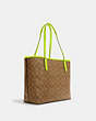 COACH®,CITY TOTE BAG IN SIGNATURE CANVAS,pvc,X-Large,Everyday,Gunmetal/Khaki/Glo Lime,Angle View