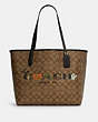 COACH®,CITY TOTE IN SIGNATURE CANVAS WITH HALLOWEEN,Signature Coated Canvas/Smooth Leather,X-Large,Gold/Khaki Multi Black,Front View