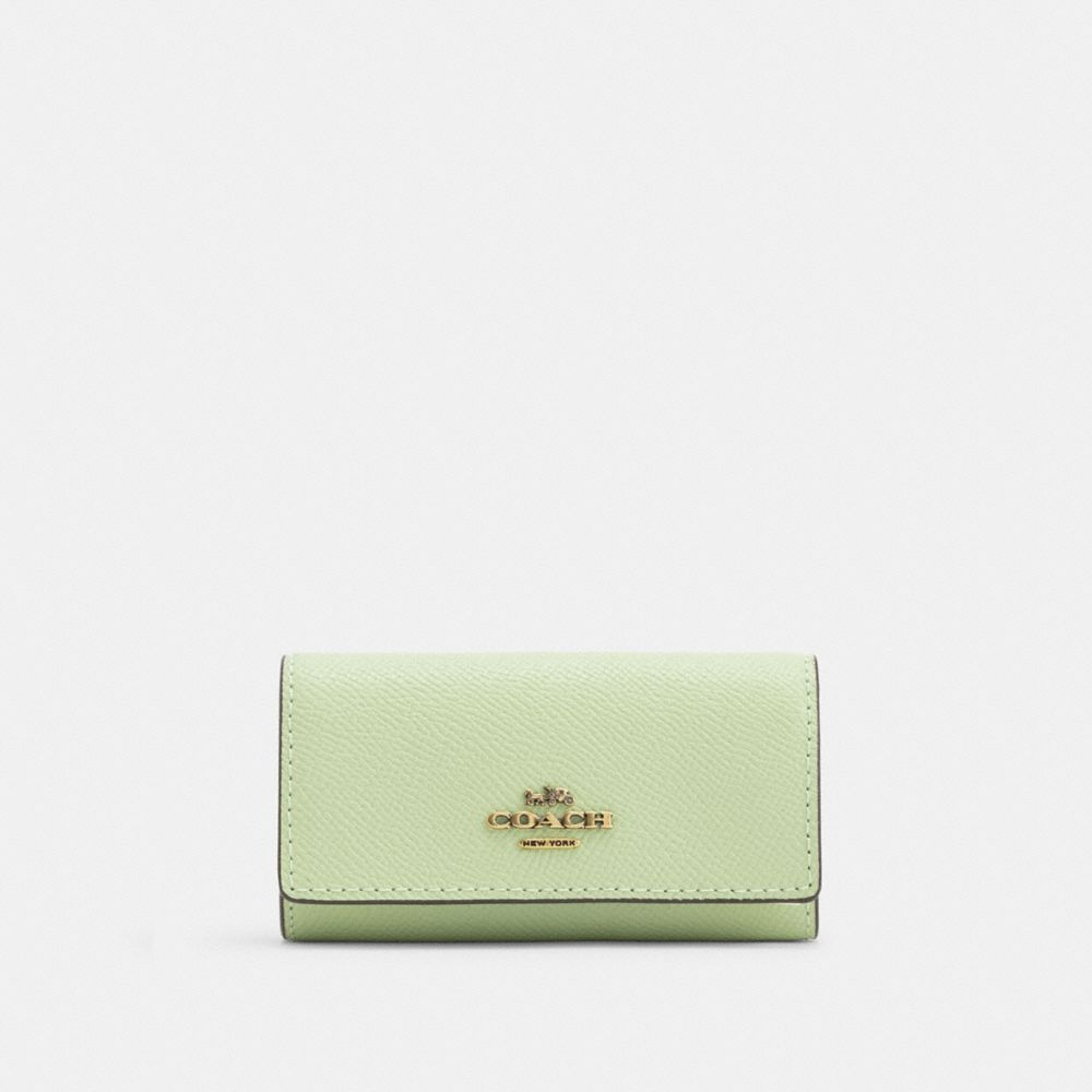 COACH®,6 リング キー ケース クロスグレイン レザー,キーケース,ﾌﾞﾗｽ/ﾍﾟｰﾙ ﾋﾟｽﾀﾁｵ