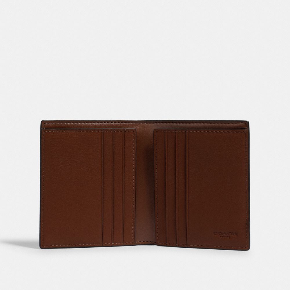 North/South Slim Bill Wallet In Signature Canvas With Coach Patch