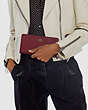 COACH®,SKINNY WALLET,Calf Leather,Mini,Brass/Wine,Detail View