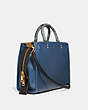 COACH®,ROGUE BAG IN COLORBLOCK WITH SNAKESKIN DETAIL,Pebble Leather/Exotic,Medium,Brass/Dark Denim,Angle View
