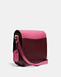 COACH®,HUTTON SADDLE BAG IN COLORBLOCK,Smooth Leather,Medium,Brass/Confetti Pink Multi,Angle View
