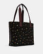 COACH®,COACH X PEANUTS TOTE WITH SNOOPY,Gold/Black Multi,Angle View