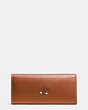 COACH®,MICKEY TURNLOCK WALLET IN SMOOTH LEATHER,Leather,Gunmetal/1941 Saddle,Angle View