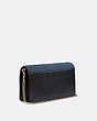 COACH®,CALLIE FOLDOVER CHAIN CLUTCH WITH QUILTING AND RIVETS,Denim,Mini,Brass/Denim,Angle View