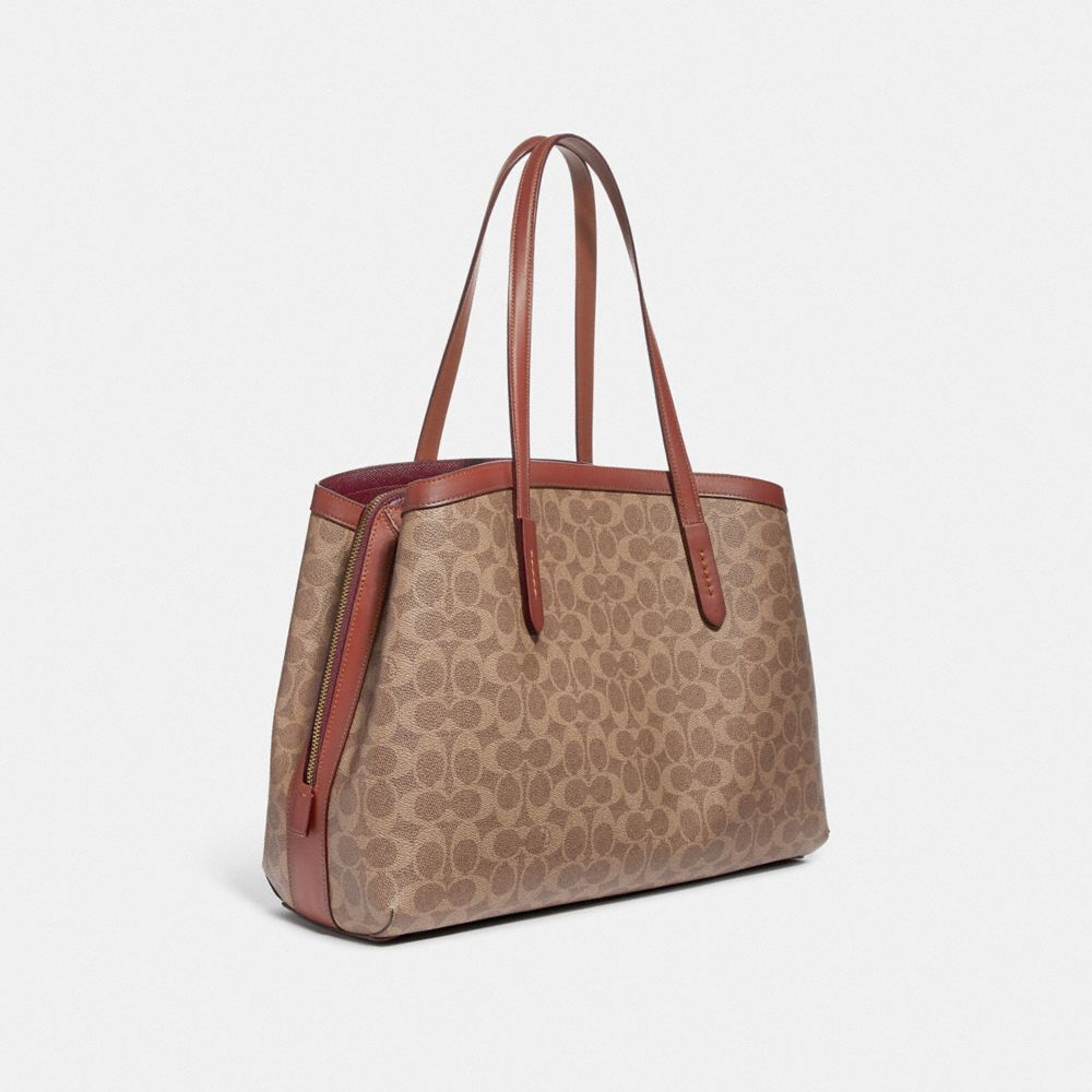 Coach charlie carryall discount signature