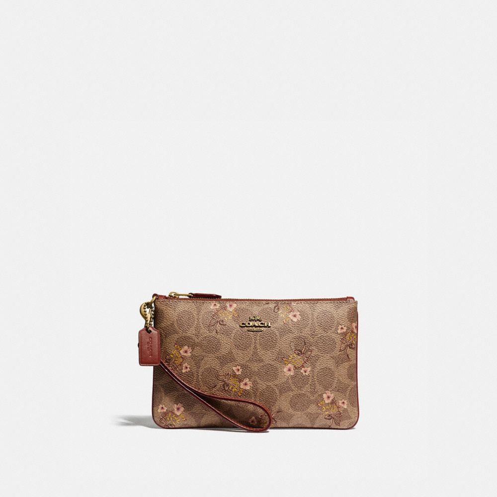 Small Wristlet In Signature Canvas With Floral Bow Print COACH