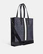 COACH®,GRAHAM STRUCTURED TOTE IN BLOCKED SIGNATURE CANVAS WITH VARSITY STRIPE,Leather,Large,Gunmetal/Denim Multi,Angle View