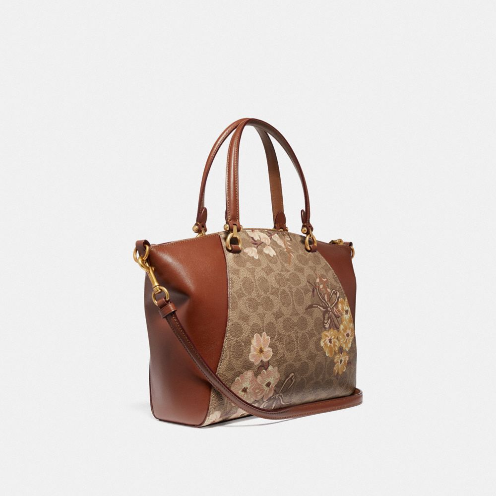 COACH®,PRAIRIE SATCHEL IN SIGNATURE CANVAS WITH PRAIRIE FLORAL PRINT,Coated Canvas,Medium,Brass/Tan Rust Bow,Angle View