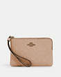 COACH®,CORNER ZIP WRISTLET IN SIGNATURE LEATHER,Leather,Mini,Gold/Taupe,Front View