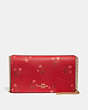 Lunar New Year Callie Foldover Chain Clutch With Floral Bow Print