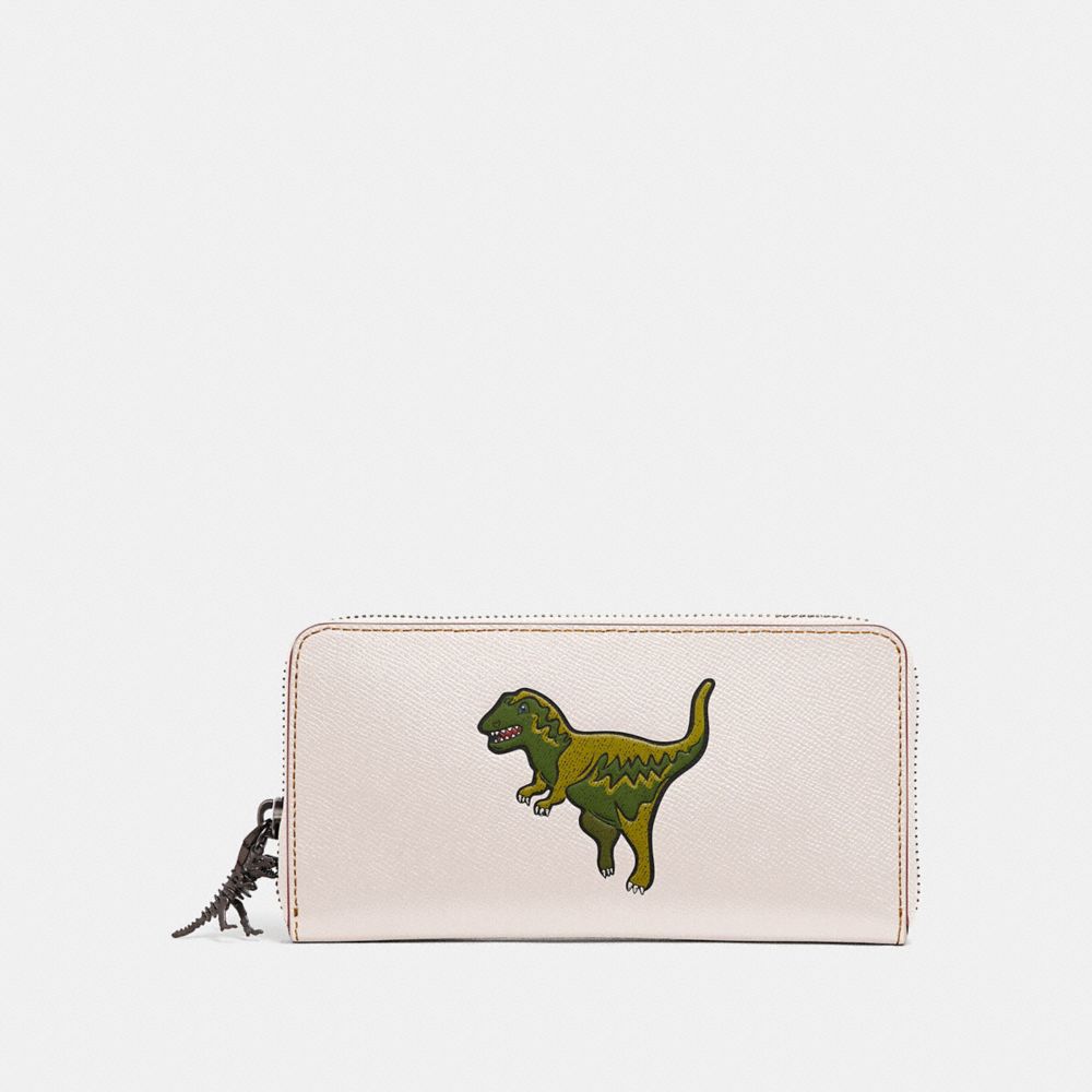 Coach wallet with dinosaur hot sale