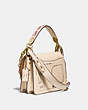 COACH®,COACH X JEAN-MICHEL BASQUIAT BEAT SHOULDER BAG 18,Leather,Small,Brass/Ivory,Angle View