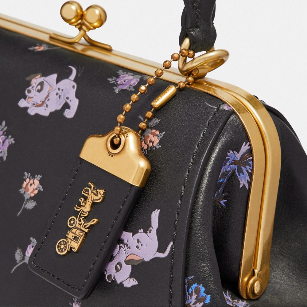 Disney x coach frame bag 23 with dalmatian floral print sale