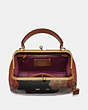 COACH®,DISNEY X COACH FRAME BAG 23 WITH EMBELLISHED PETER PAN,pvc,Small,Brass/Tan/Rust,Inside View,Top View