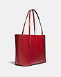 COACH®,DISNEY X COACH MARKET TOTE WITH DISNEY MOTIF,Leather,Large,Pewter/1941 Red,Angle View