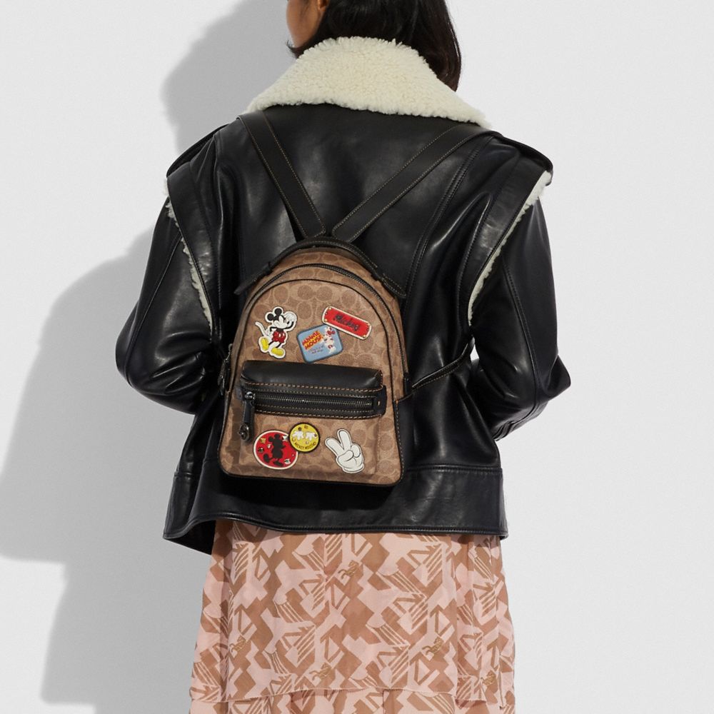 Disney x coach campus cheap backpack 23 in signature patchwork