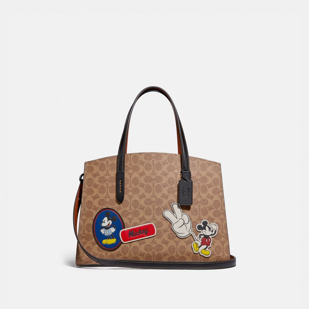 Disney X Coach Charlie Carryall In Signature Canvas With Patches