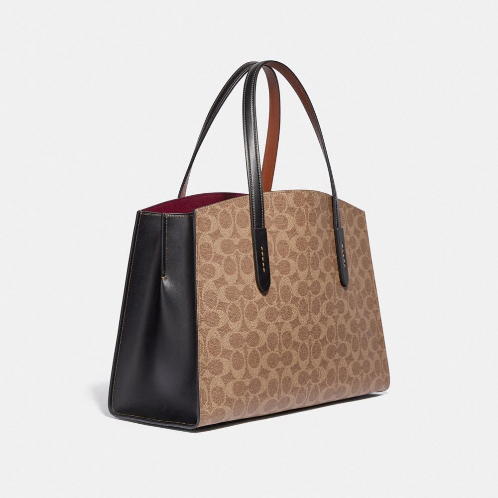 Disney X Coach Charlie Carryall en toile signature avec patchs