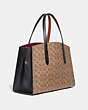 COACH®,DISNEY X COACH CHARLIE CARRYALL IN SIGNATURE CANVAS WITH PATCHES,pvc,Large,Pewter/Tan Black Multi,Angle View