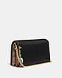 COACH®,DISNEY X COACH CALLIE FOLDOVER CHAIN CLUTCH WITH THUMPER,Leather,Mini,Gold/Black,Angle View