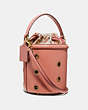 COACH®,DRAWSTRING BUCKET BAG WITH GROMMETS,Leather,Medium,Brass/Light Peach,Angle View