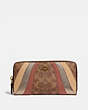 COACH®,ACCORDION ZIP WALLET IN SIGNATURE CANVAS WITH WAVE PATCHWORK,pvc,Brass/Tan Multi,Front View