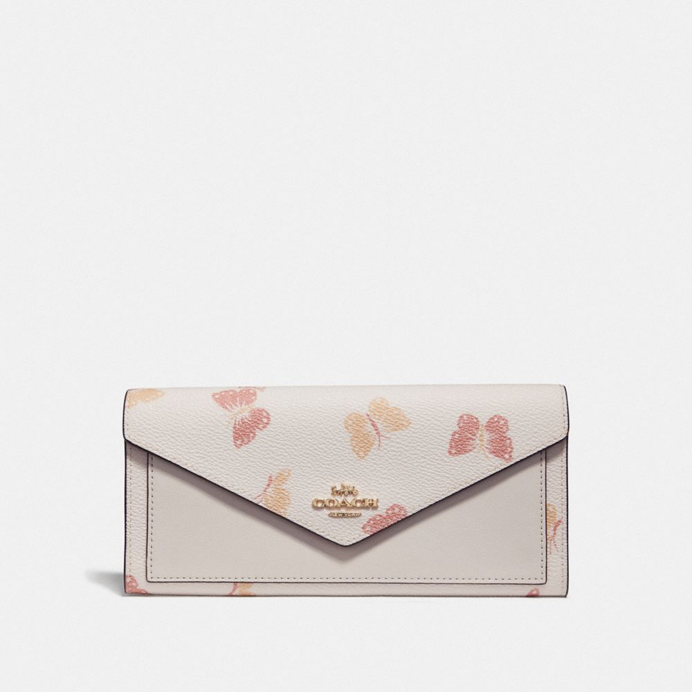 Coach pink 2024 butterfly wallet