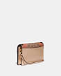 COACH®,HAYDEN FOLDOVER CROSSBODY CLUTCH IN SIGNATURE CANVAS WITH WAVE PATCHWORK,Leather,Mini,Brass/Tan Multi,Angle View