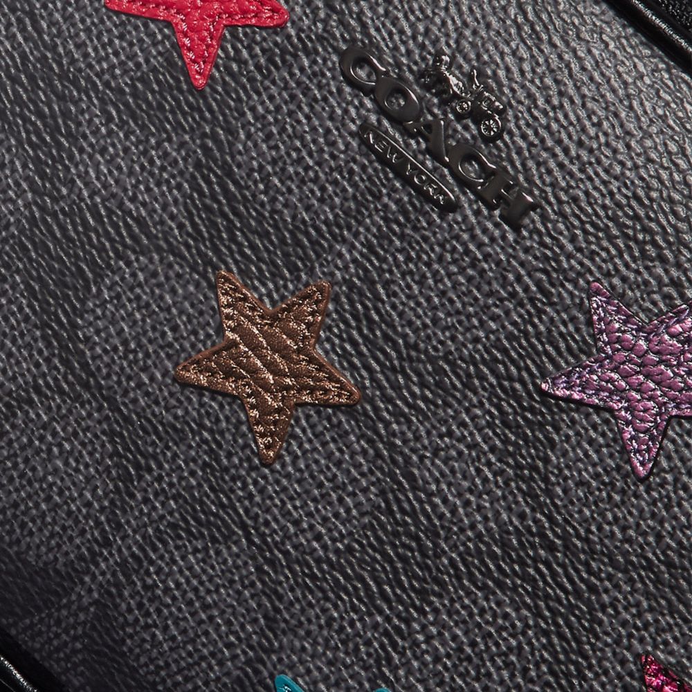 COACH®,Sadie Crossbody Clutch In Signature Canvas With Star Applique And Snakeskin Detail,,Closer View