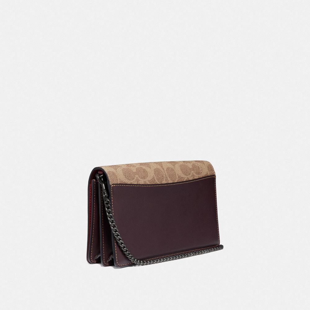COACH®,CALLIE FOLDOVER CHAIN CLUTCH IN SIGNATURE CANVAS WITH REXY BY YETI OUT,pvc,Mini,Pewter/Tan Oxblood,Angle View