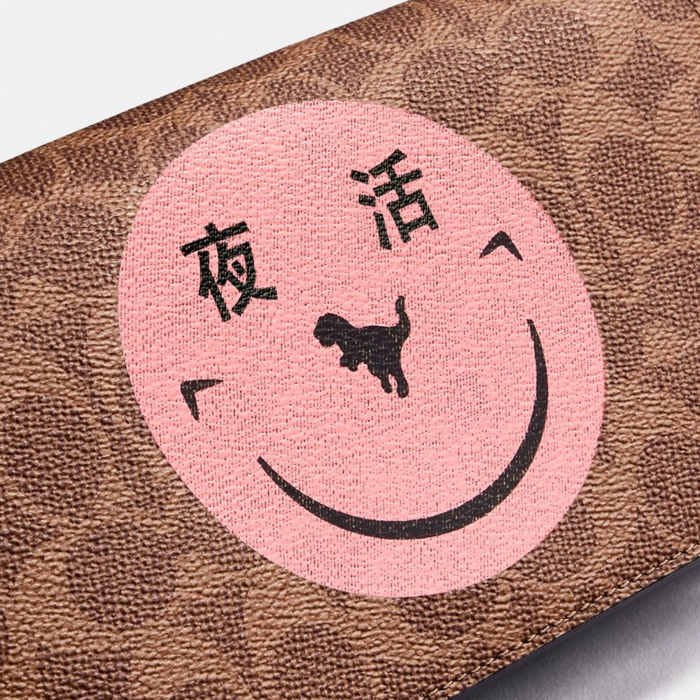 COACH®,Callie Foldover Chain Clutch In Signature Canvas With Rexy By Yeti Out,,Closer View