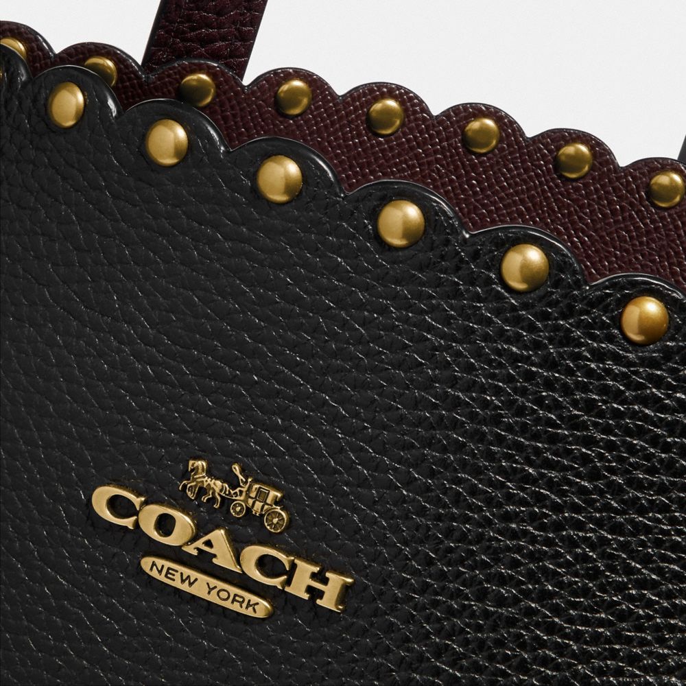 Coach charlie cheap carryall with rivets