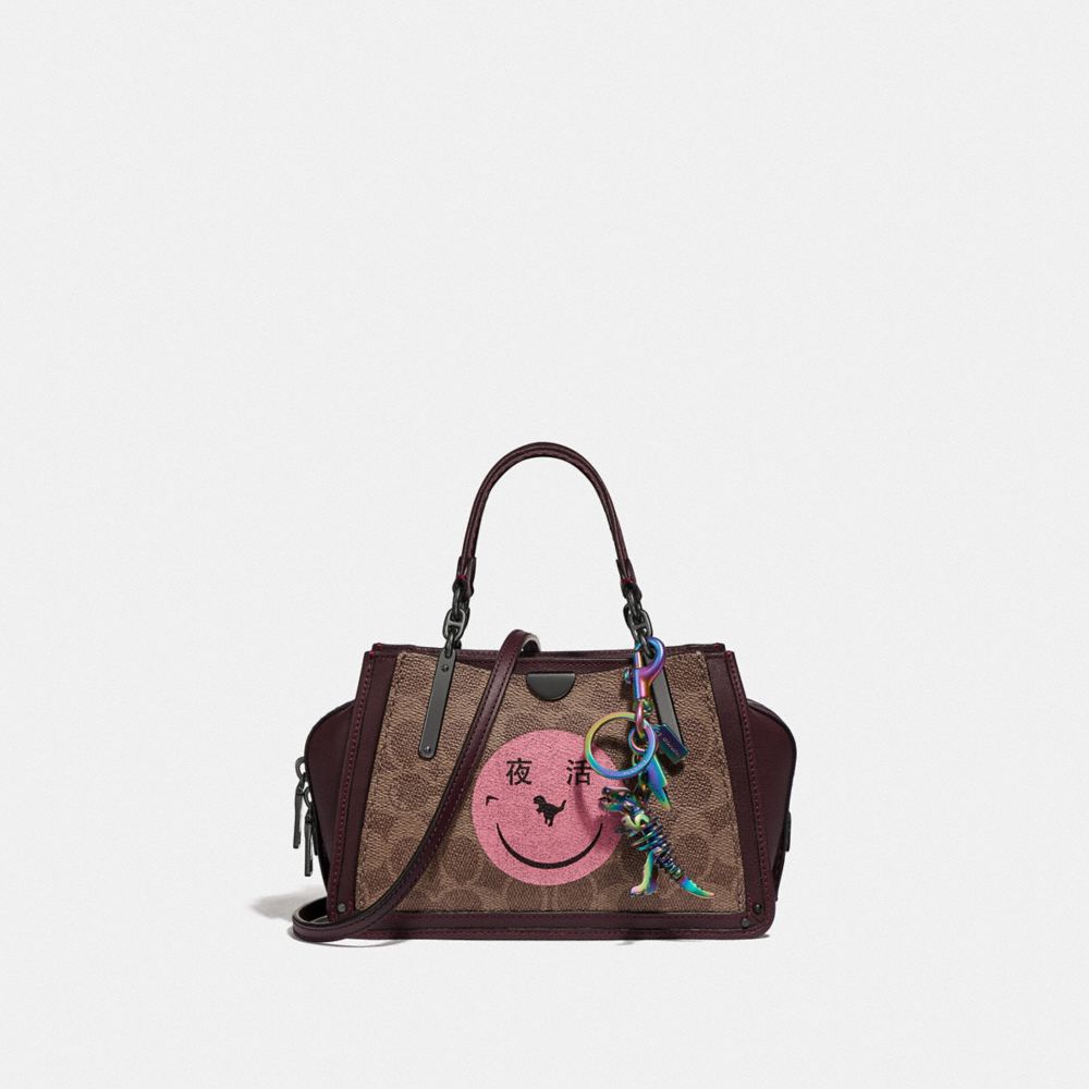 COACH®,Dreamer 21 In Signature Canvas With Rexy By Yeti Out,,Angle View