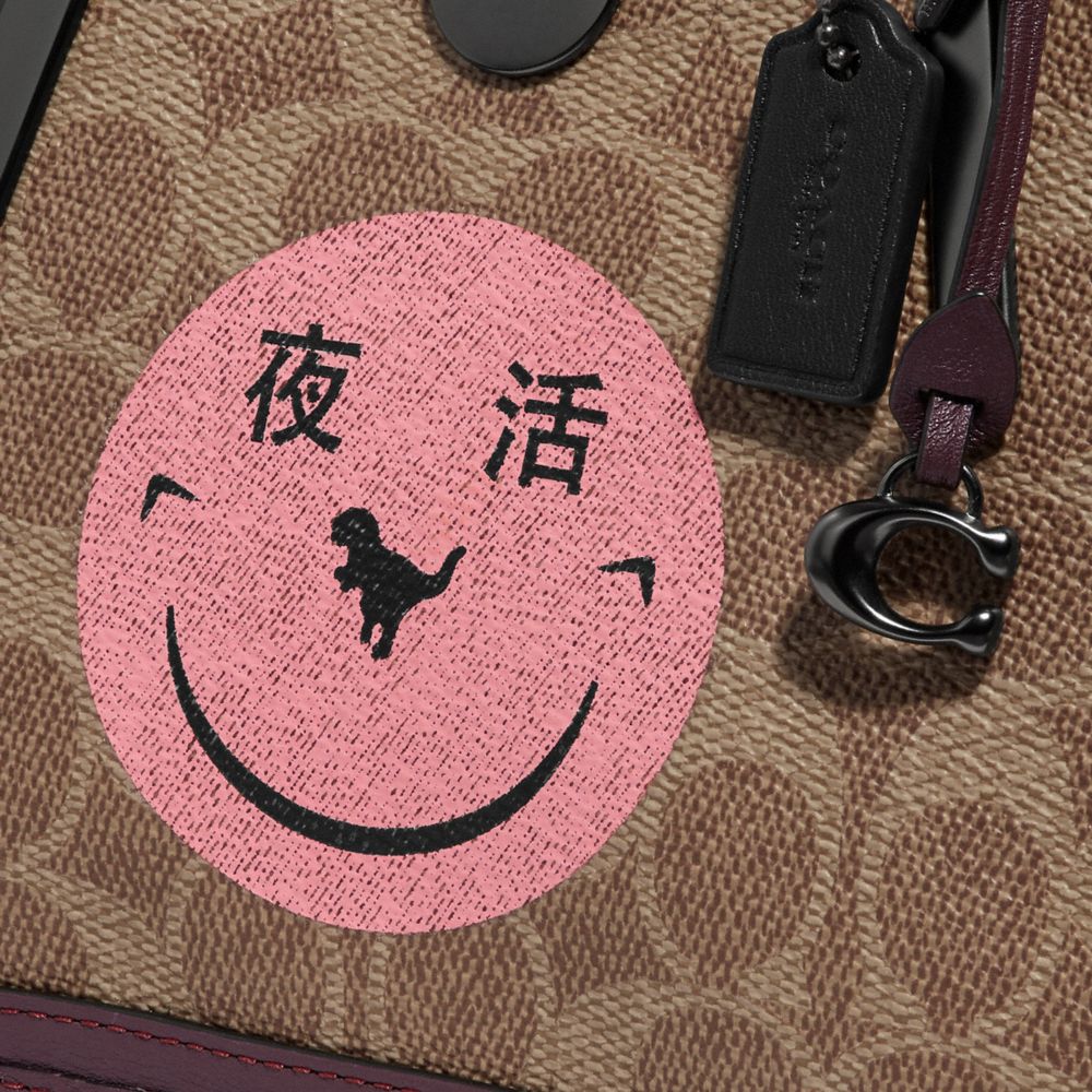 COACH®,Dreamer 21 In Signature Canvas With Rexy By Yeti Out,,Closer View