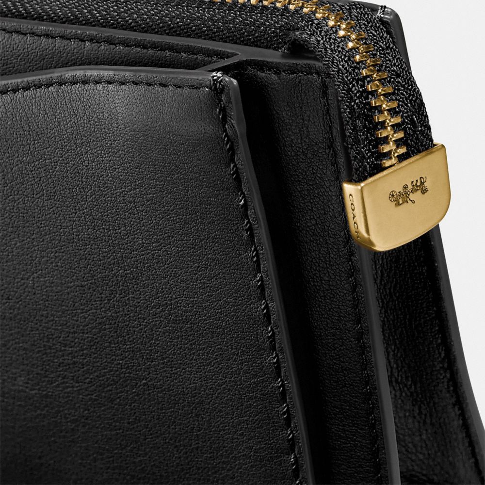 COACH®,DREAMER WRISTLET,Leather,Brass/Black,Closer View