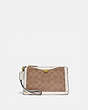 COACH®,DREAMER WRISTLET IN SIGNATURE CANVAS,Coated Canvas,Brass/Tan Chalk,Front View