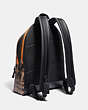 COACH®,ACADEMY BACKPACK IN SIGNATURE CANVAS WITH REXY BY GUANG YU,Coated Canvas,Large,Black Copper/Khaki,Angle View