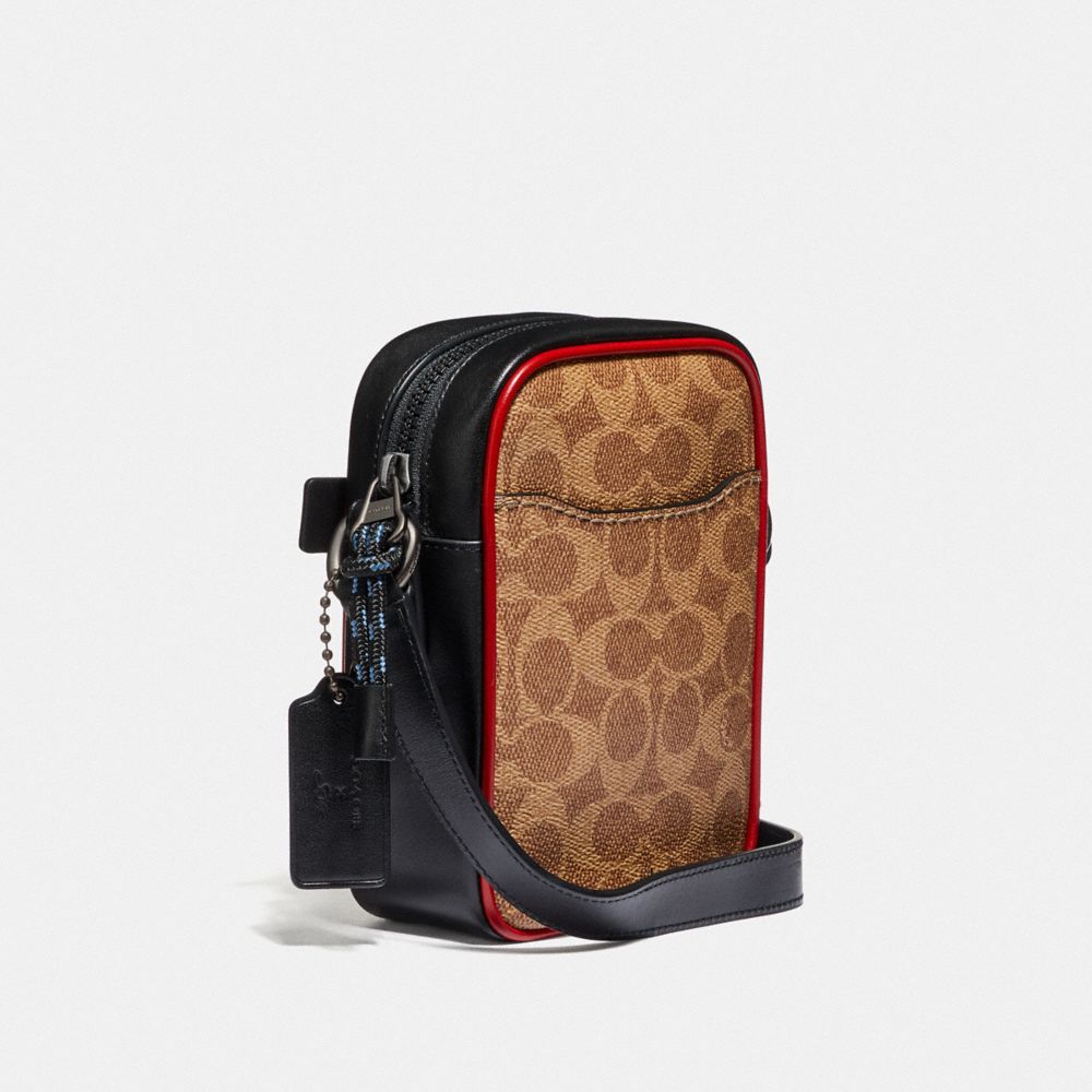 COACH®,Dylan 10 In Signature Canvas With Rexy By Sui Jianguo,,Angle View