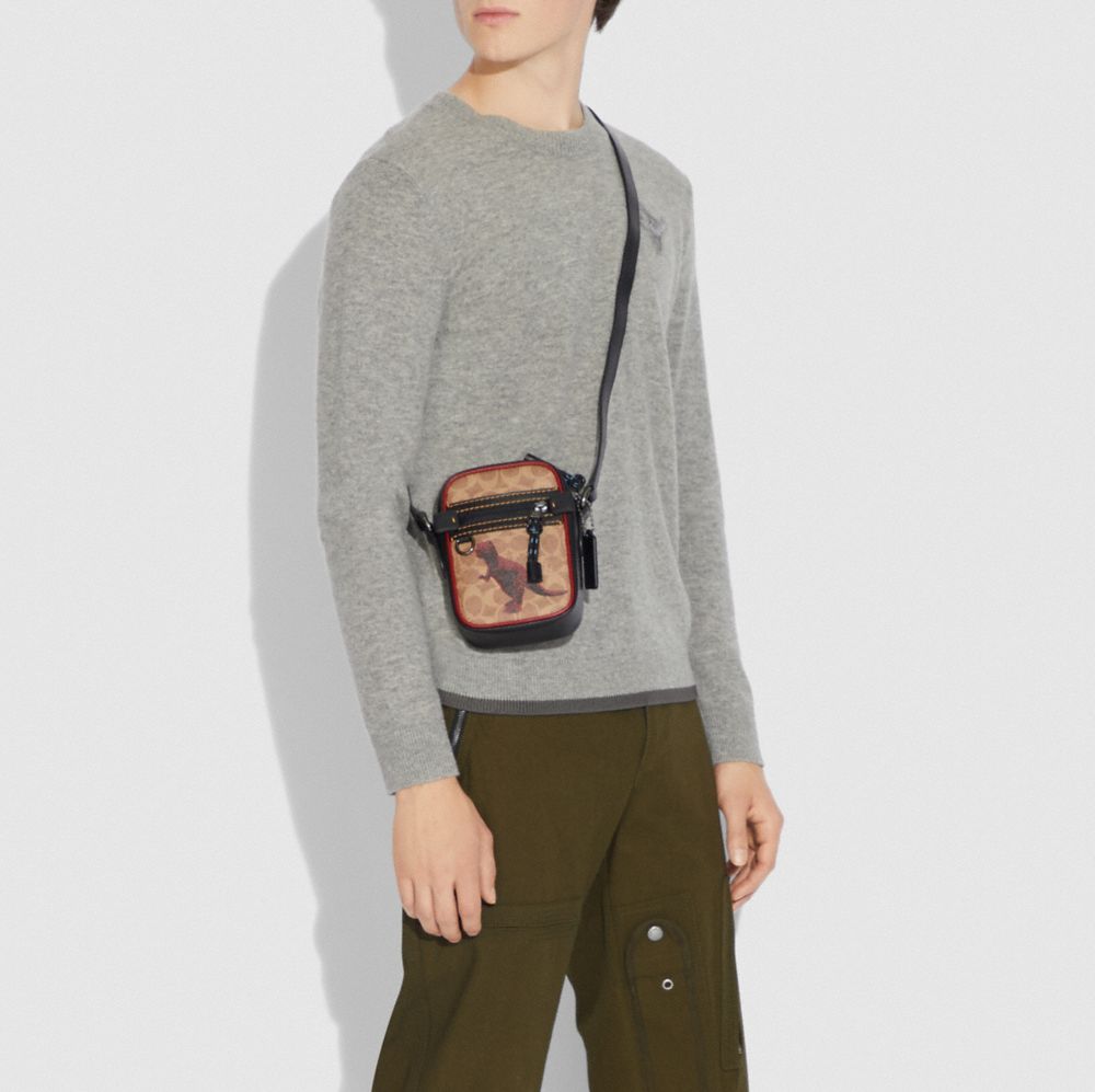 COACH®,Dylan 10 In Signature Canvas With Rexy By Sui Jianguo,,Detail View