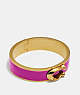 COACH®,SIGNATURE LARGE HINGED BANGLE,Plated Brass,Gold/Pink,Front View