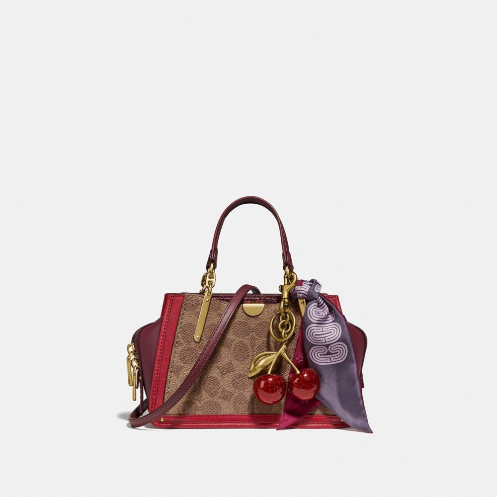COACH®,DREAMER 21 IN SIGNATURE CANVAS WITH SNAKESKIN DETAIL,pvc,Small,Gold/Tan Red Apple,Angle View