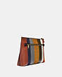 COACH®,LARGE CHARLIE POUCH WITH PATCHWORK STRIPES,Leather,Medium,Brass/Oxblood Multi,Angle View