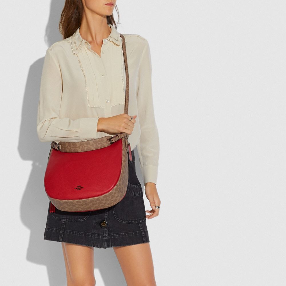 Coach sutton crossbody discount in signature canvas