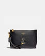 COACH®,DISNEY X COACH CHARLIE POUCH WITH MINNIE MOUSE MOTIF,Pebble Leather,Brass/Black,Front View