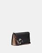 COACH®,DINKY WITH SIGNATURE CANVAS DETAIL AND SOUVENIR PINS,pvc,Mini,Tan/Black/Pewter,Angle View