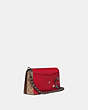 COACH®,DINKY WITH SIGNATURE CANVAS DETAIL AND SOUVENIR PINS,Coated Canvas,Small,Pewter/Tan Red Apple,Angle View