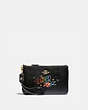COACH®,WIZARD OF OZ BOXED SMALL WRISTLET WITH MOTIF,Pebble Leather,Gold/Black,Front View