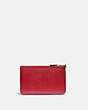 COACH®,WIZARD OF OZ BOXED SMALL WRISTLET WITH MOTIF,Pebble Leather,Silver/Red Apple,Back View